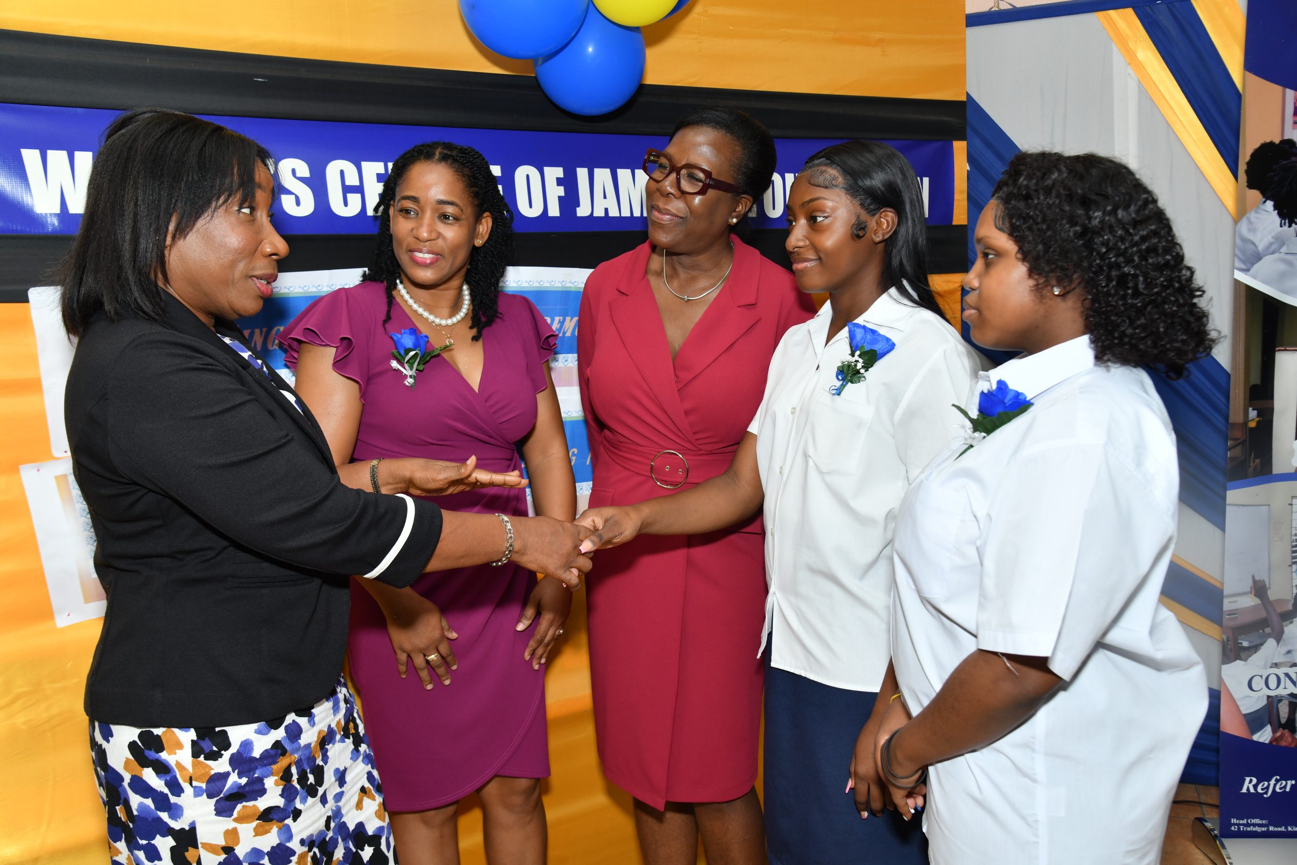 Sandra Jones (left), Manager, Public Sector Engagement, JN Bank, congratulates Nyalia Cookkorne (second right) and Treshanna Thompson (right) on their outstanding academic performance. The occasion was the graduation ceremony for 13 adolescent mothers at the Women’s Centre of Jamaica in St Andrew on July 2. Sharing in the special moment are Marlene Murray-Brown, Acting Centre Manager and Counsellor, WCJF; and Novlette Howell, Executive Director, WCJF.